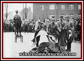 Verbrennung roter und schwarzrotgelber Fahnen am Bahnhof Tempelhof, 10. März 1933.