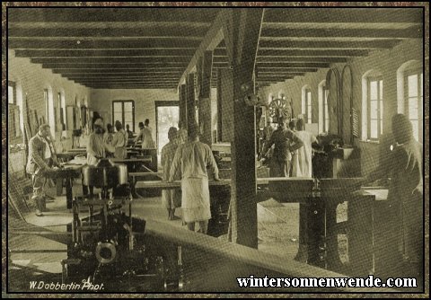 Native carpenters at work in a mission workshop, German East Africa.