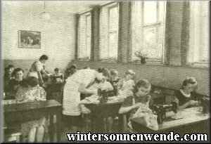 Sewing class in the German school of home economics.